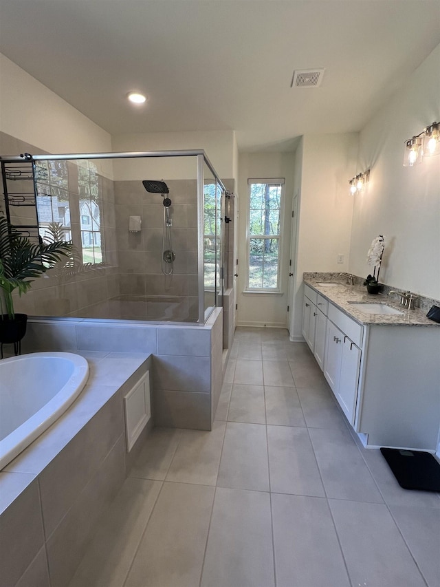 bathroom featuring tile patterned floors, vanity, and independent shower and bath