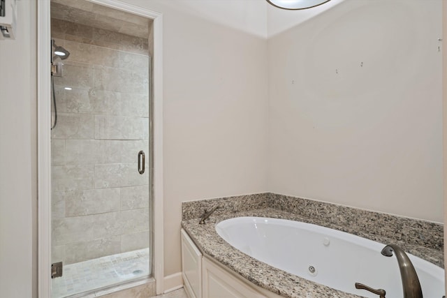 bathroom with separate shower and tub