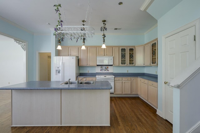 kitchen featuring light brown cabinetry, white appliances, sink, a center island with sink, and hanging light fixtures