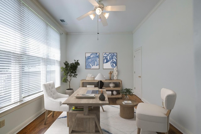 dining room featuring hardwood / wood-style flooring, ceiling fan, and ornamental molding