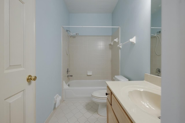 full bathroom with tile patterned flooring, vanity, toilet, and tiled shower / bath