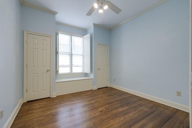 unfurnished room featuring ceiling fan, dark hardwood / wood-style flooring, and crown molding