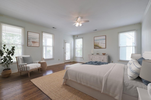 bedroom featuring multiple windows, crown molding, ceiling fan, and dark wood-type flooring