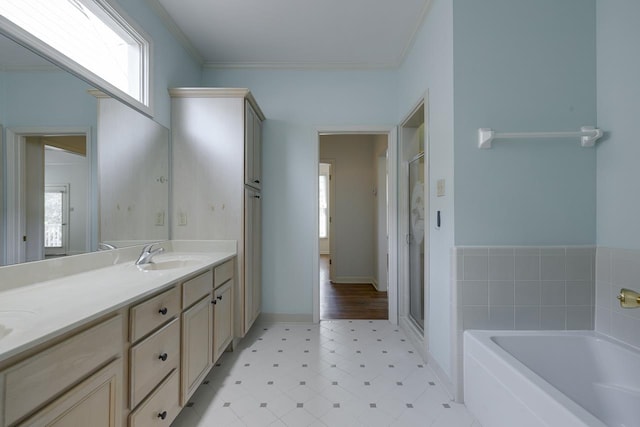 bathroom with plus walk in shower, vanity, and crown molding