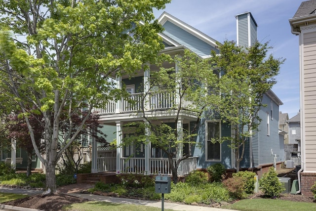 view of front of home with a balcony and covered porch