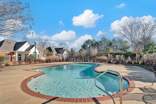 view of swimming pool with a patio area