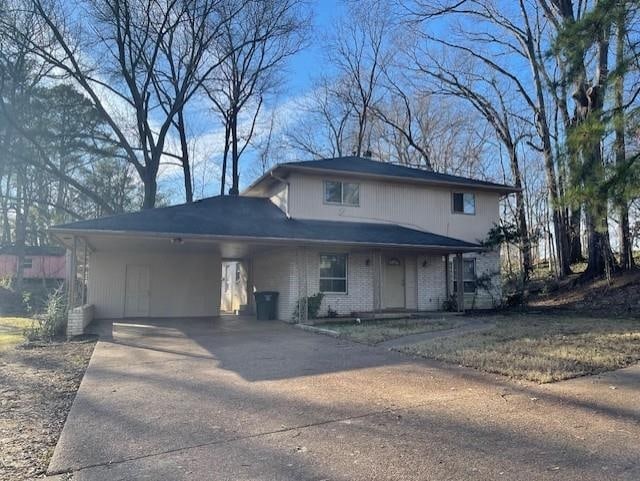 view of front of home featuring a carport