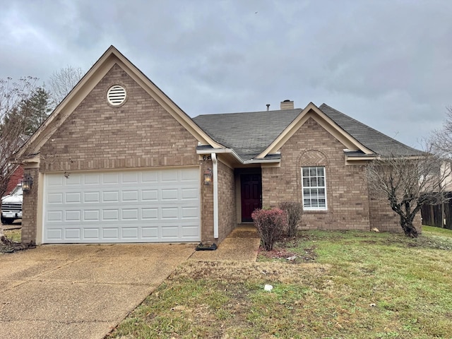 view of front facade featuring a front yard and a garage