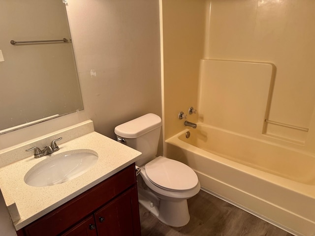 full bathroom with shower / bath combination, vanity, toilet, and wood-type flooring