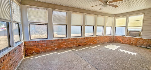 unfurnished sunroom featuring ceiling fan and cooling unit