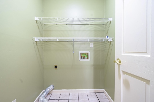 laundry area featuring hookup for an electric dryer, light tile patterned floors, and hookup for a washing machine