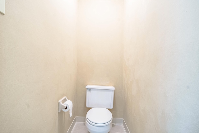 bathroom featuring tile patterned floors and toilet