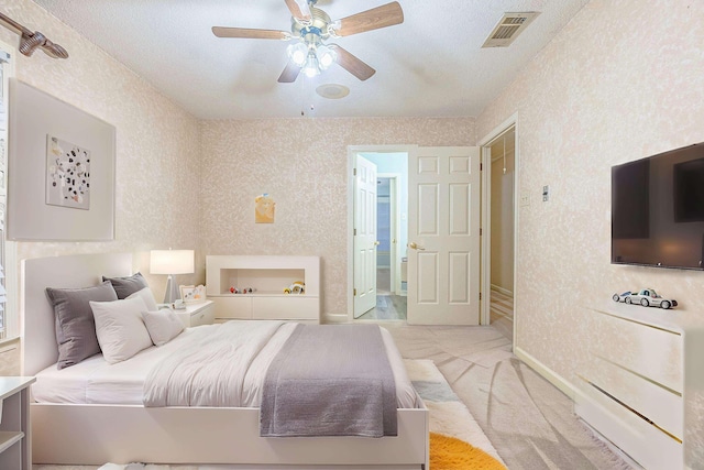 bedroom featuring light carpet and ceiling fan