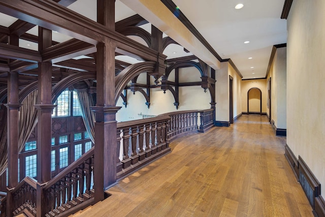 hall featuring crown molding and hardwood / wood-style flooring