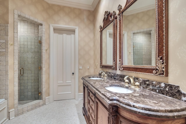 bathroom featuring vanity, a shower with door, and ornamental molding