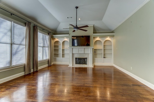 unfurnished living room with lofted ceiling, ceiling fan, built in features, and a fireplace