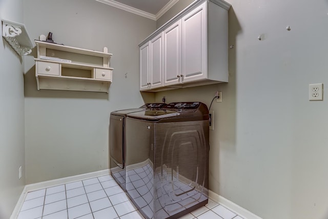 washroom featuring cabinets, light tile patterned floors, independent washer and dryer, and ornamental molding