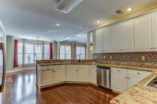 kitchen with dishwasher, sink, kitchen peninsula, a chandelier, and decorative light fixtures