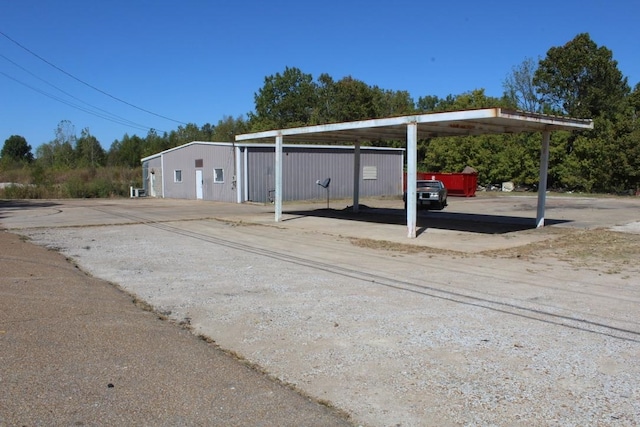 view of vehicle parking featuring a carport