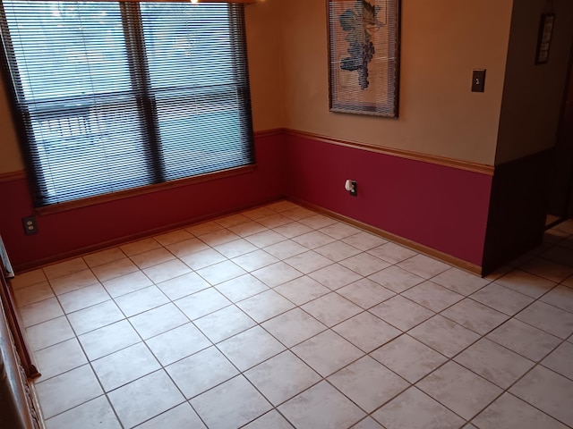 empty room with light tile patterned floors