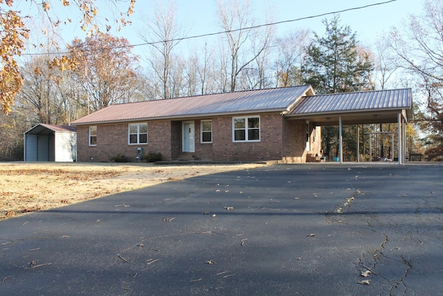 ranch-style home featuring a carport