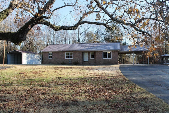 single story home featuring a carport and a front yard