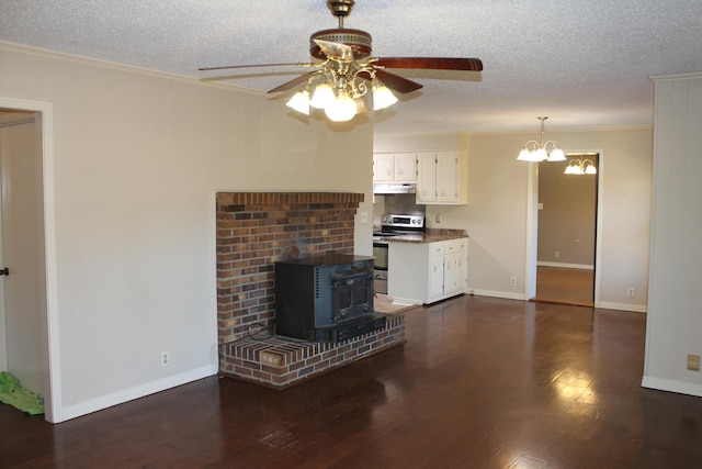 unfurnished living room with ceiling fan with notable chandelier, dark hardwood / wood-style flooring, a textured ceiling, and ornamental molding