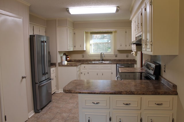 kitchen featuring white cabinets, appliances with stainless steel finishes, ornamental molding, and sink