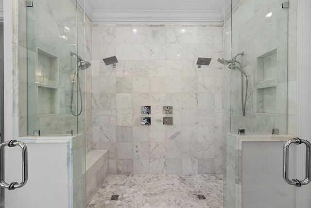 bathroom featuring a shower with shower door and crown molding