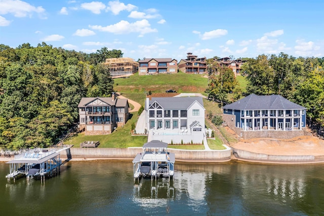 birds eye view of property featuring a water view