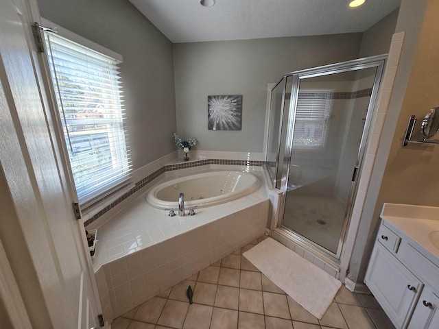 bathroom featuring tile patterned floors, separate shower and tub, and a healthy amount of sunlight