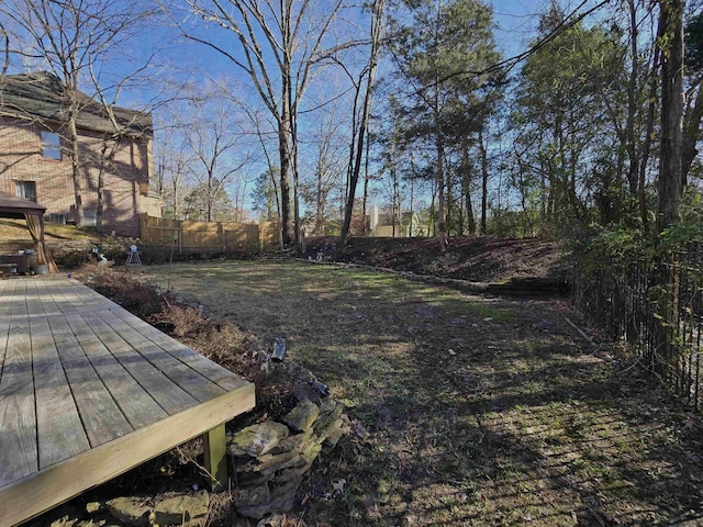 view of yard with a wooden deck