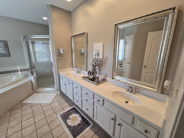 bathroom featuring vanity, tile patterned flooring, and plus walk in shower