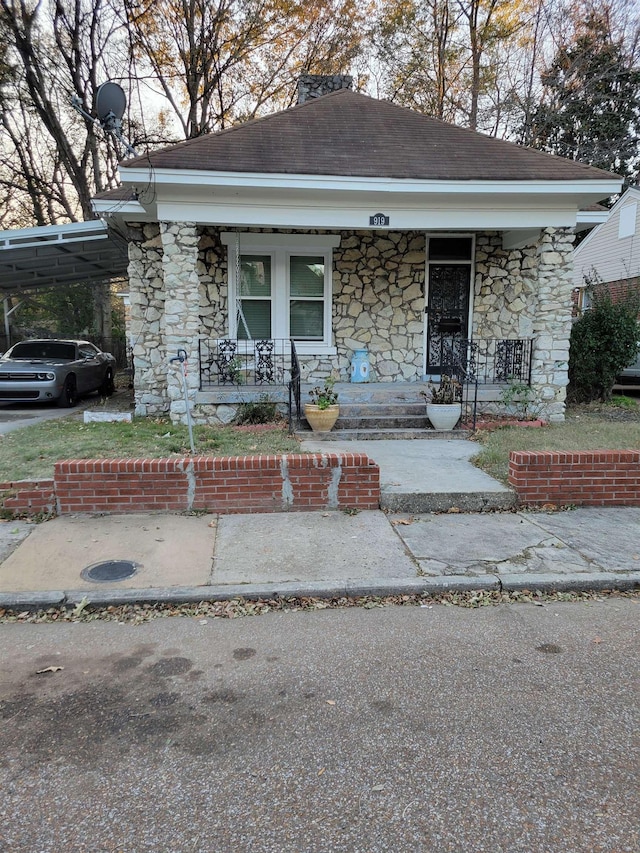 bungalow with a carport and a porch