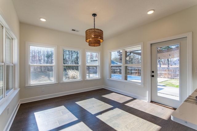 unfurnished sunroom with plenty of natural light