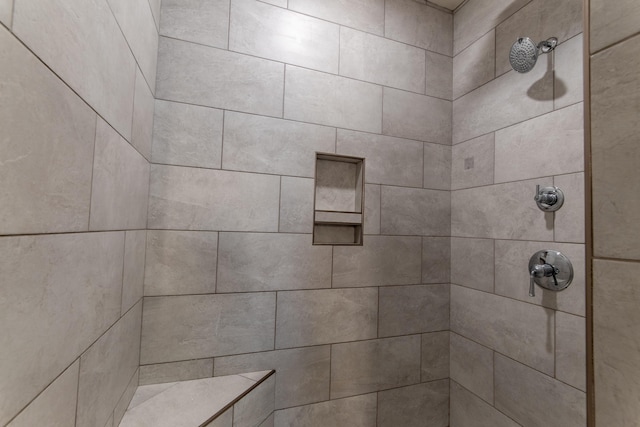 bathroom featuring tiled shower