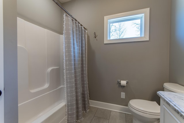 full bathroom with tile patterned floors, vanity, toilet, and shower / bath combo with shower curtain