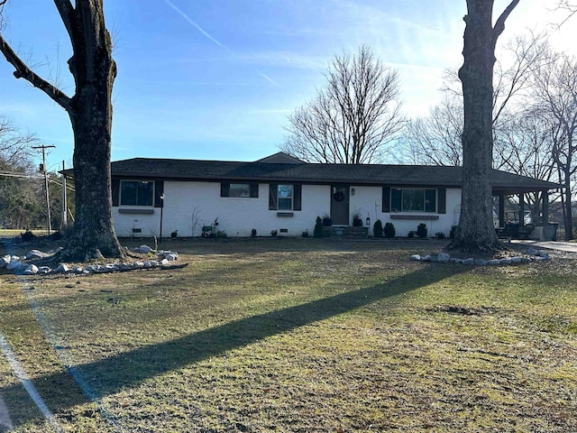 ranch-style home with a front lawn