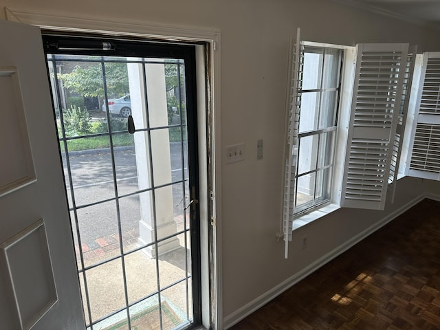 doorway to outside featuring dark parquet flooring