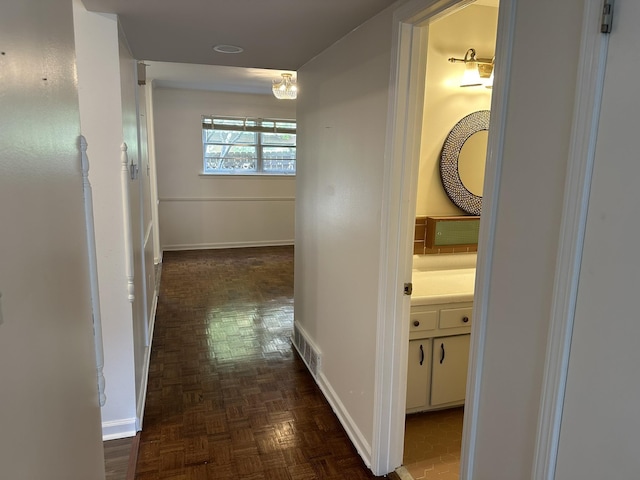 corridor with dark parquet floors