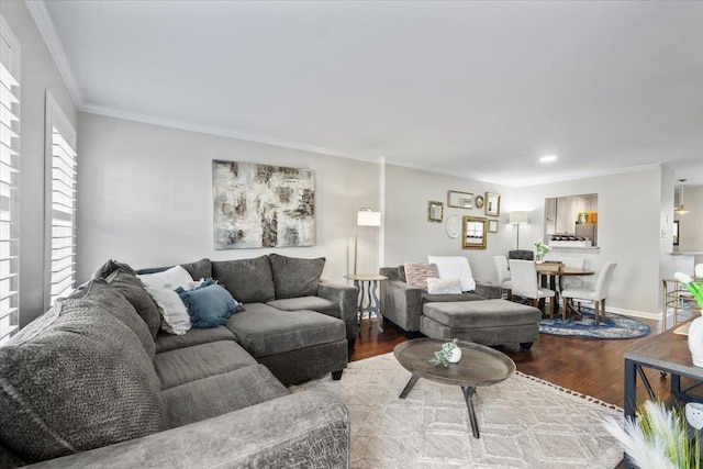 living room with light hardwood / wood-style floors and ornamental molding