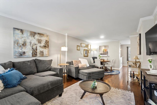 living room featuring hardwood / wood-style flooring and crown molding