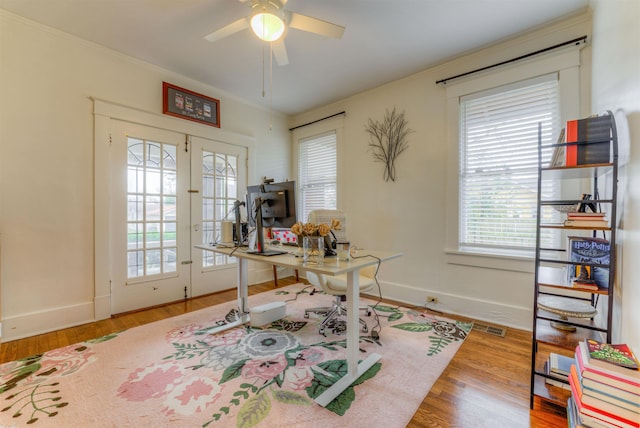 office area with ceiling fan, wood-type flooring, crown molding, and french doors