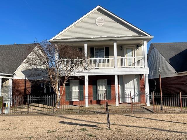 view of front of house with a balcony and a porch