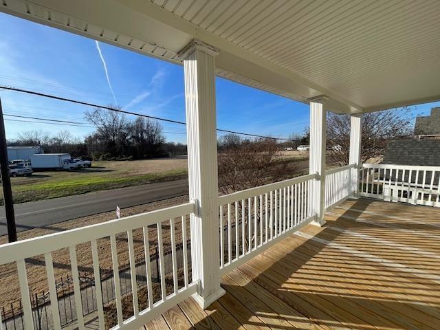 wooden deck featuring covered porch