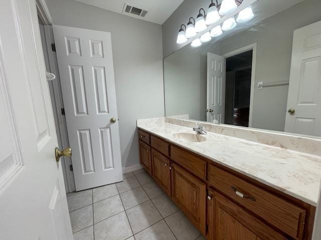 bathroom with tile patterned floors and vanity