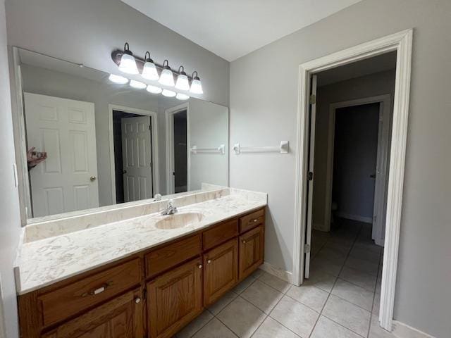 bathroom with tile patterned flooring and vanity