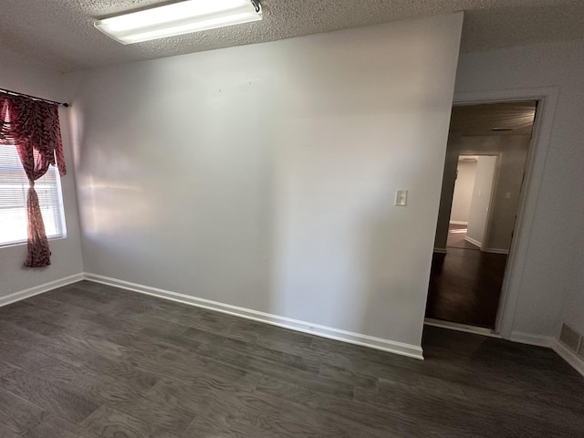 empty room featuring a textured ceiling