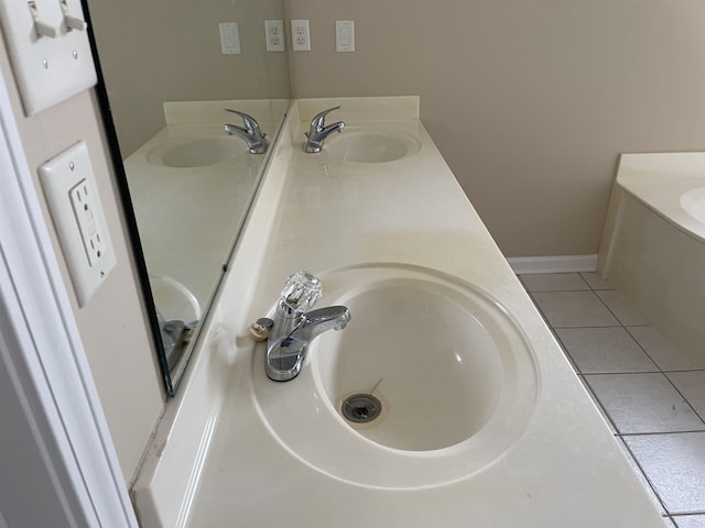 bathroom with tile patterned flooring and vanity