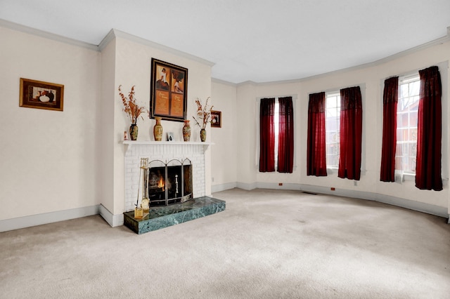 unfurnished living room with carpet floors, a brick fireplace, and ornamental molding